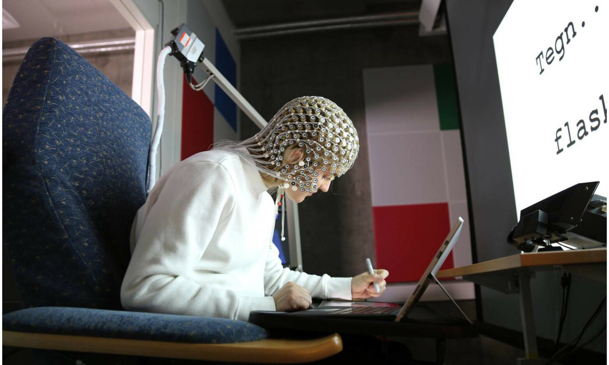 Experimental set-up with a participant wearing the Geodesic Sensor Net.